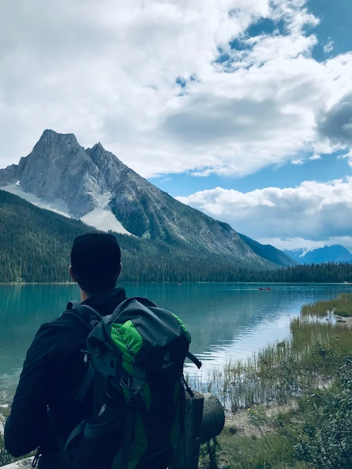 Marcus at the mountains looking out at the lake