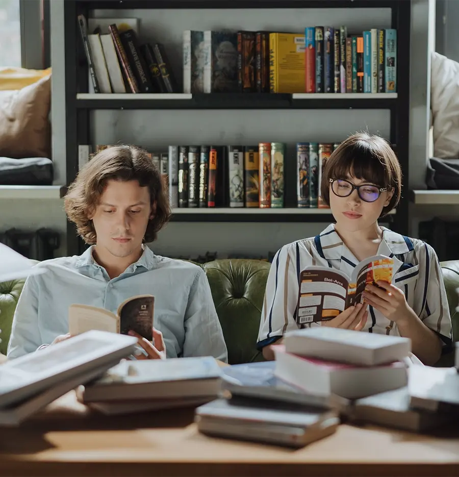 Two people reading books