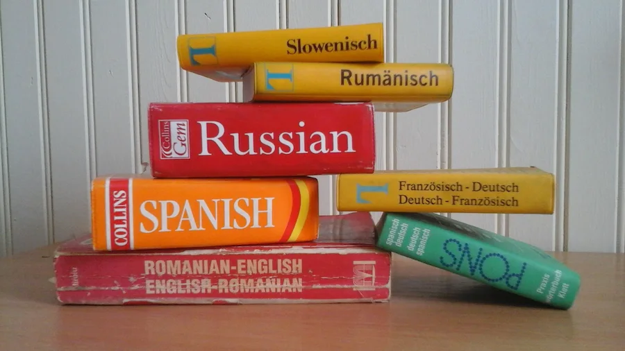 Various books stacked on a table